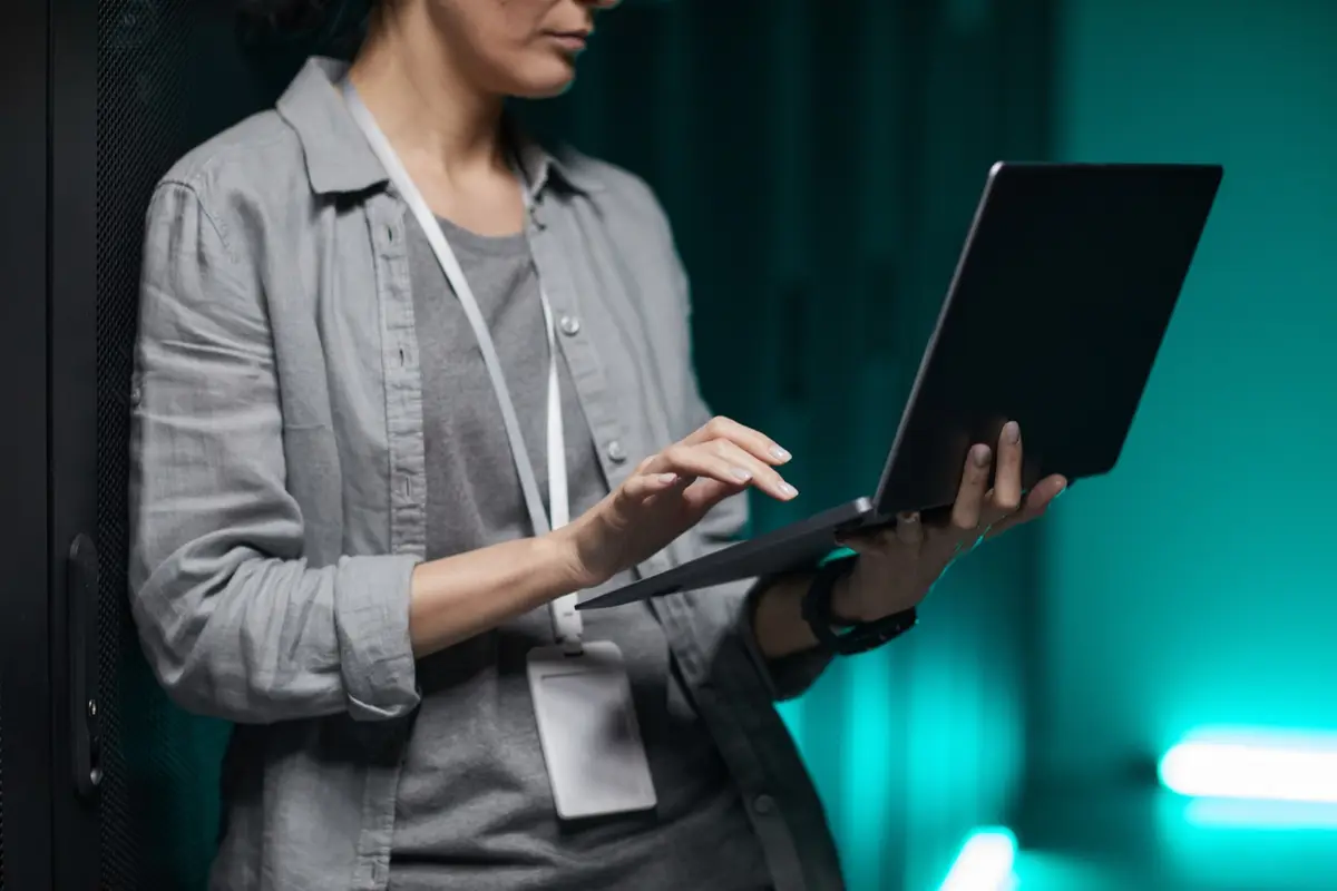 Team member working on a laptop